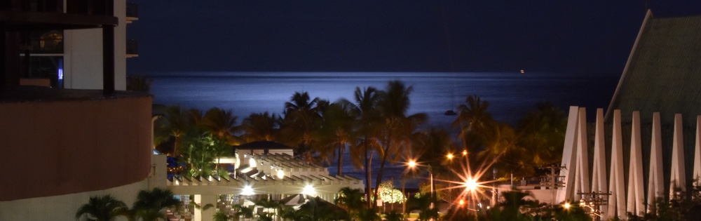 Honolulu at night by Kirk Hopkins