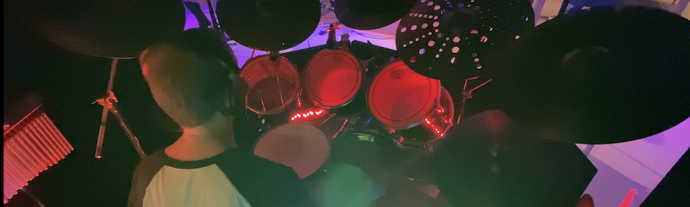 Class images: drummer in a cage by Kirk Hopkins